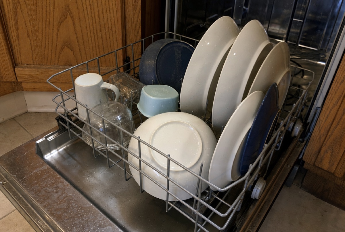 A loaded dishwasher rack in a Baltimore, MD kitchen, one of the GE appliances Doctor Maintenance repairs at a flat price approved up front