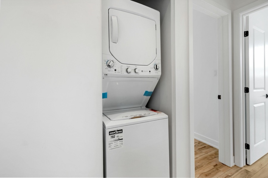 A stacked washer and dryer in a Baltimore, MD home, the kind of laundry setup customers ask Doctor Maintenance to check when a unit quits