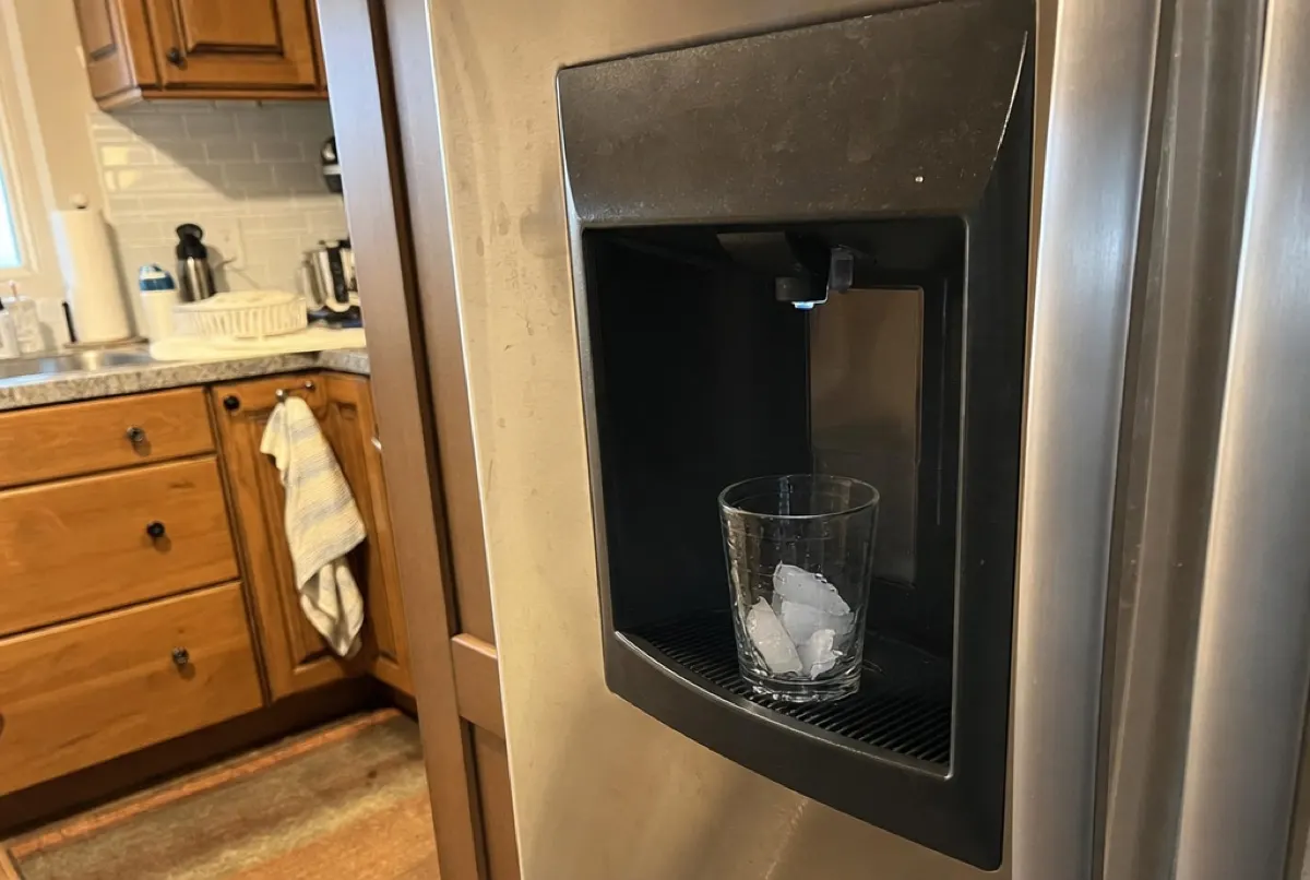 A refrigerator ice and water dispenser in a lived-in Baltimore, MD kitchen serviced by Doctor Maintenance