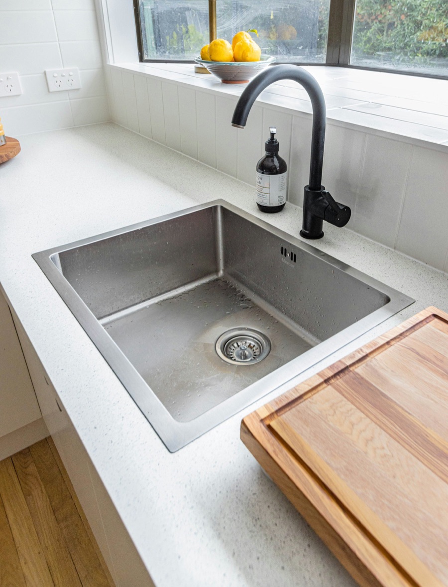 A kitchen sink with a garbage disposal in a lived-in Baltimore, MD home repaired by Doctor Maintenance