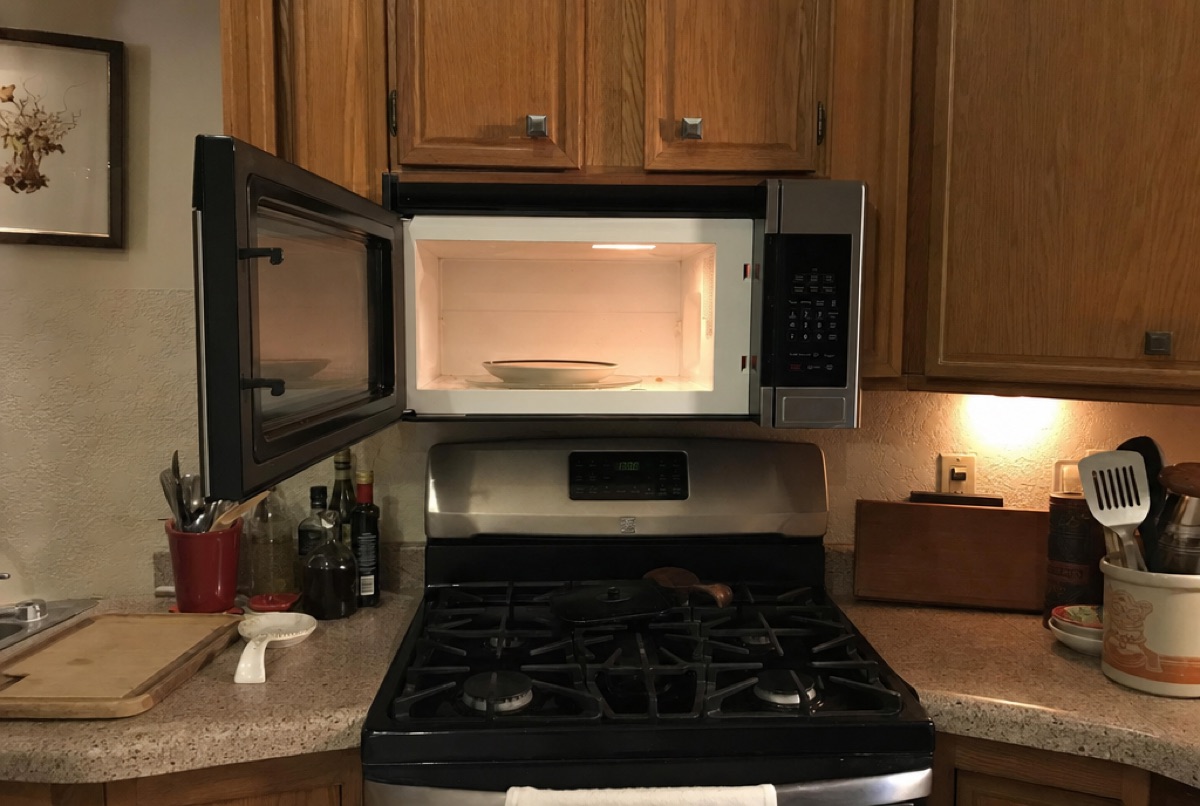An over-the-range microwave with its door open during a Baltimore, MD microwave repair by Doctor Maintenance