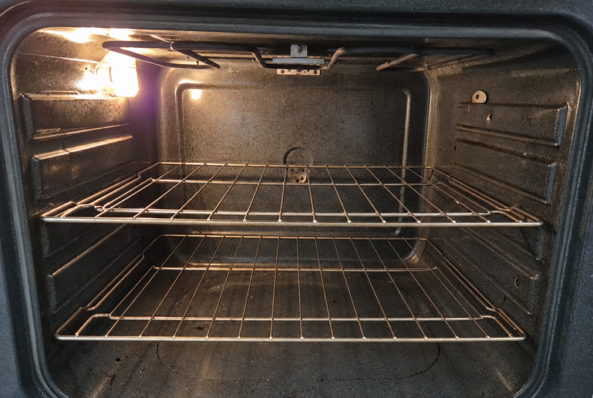 Inside a home oven showing the heating element and racks during a Baltimore, MD oven repair diagnosis