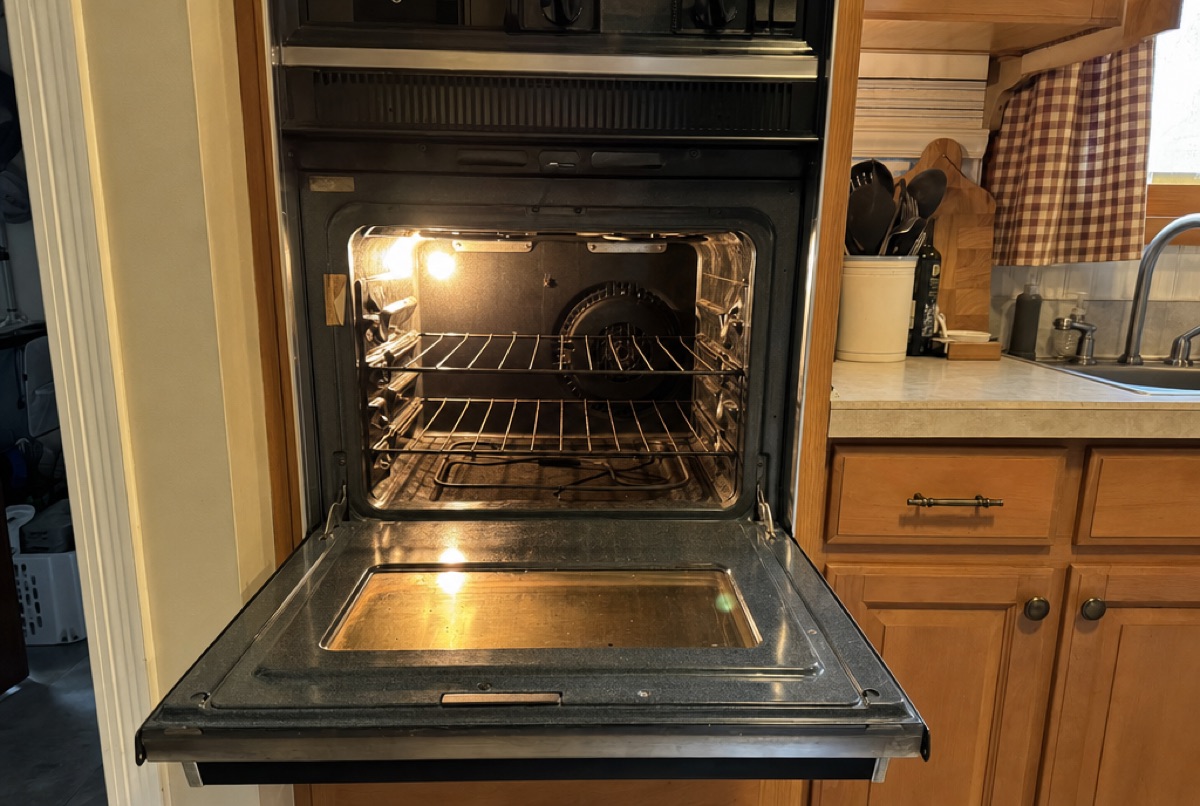 A wall oven with the door open in a lived-in Baltimore, MD kitchen repaired by Doctor Maintenance